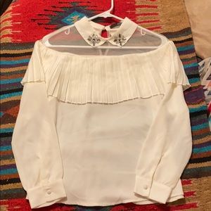 White ruffled and mesh top